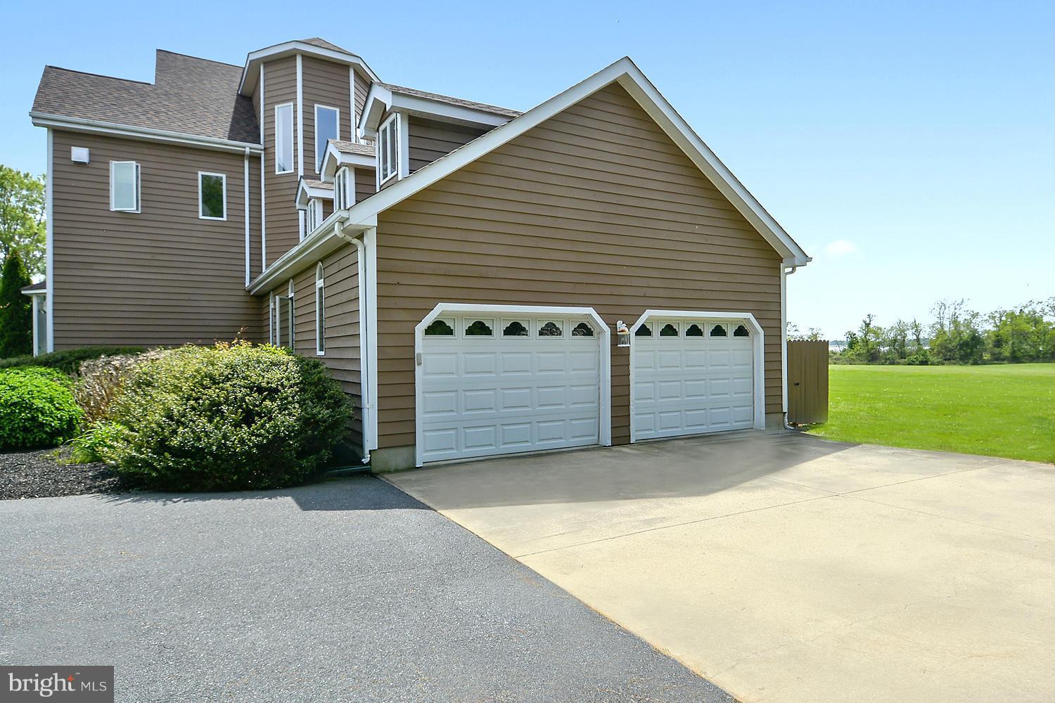 2818 Cox Neck Road Chester, MD 21619 - Photo 8 of 30 Side Loading 2-Car Garage w/Expanded Parking Pad