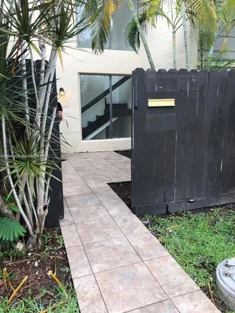 a kitchen with granite countertop a stove a sink and a microwave