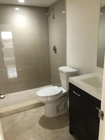 a view of closet with wooden floor