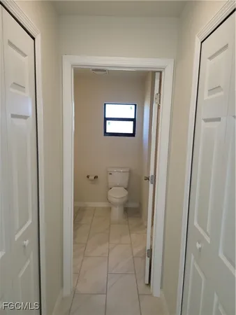 a view of a bathroom from a hallway