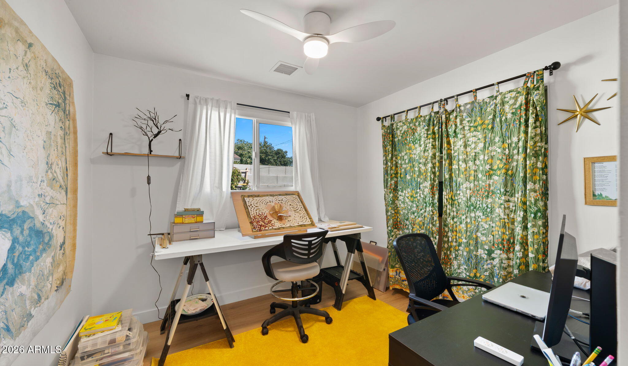 2115 North Normal Avenue Tempe, AZ 85288 - Photo 22 of 38 a view of a workspace with furniture and a window