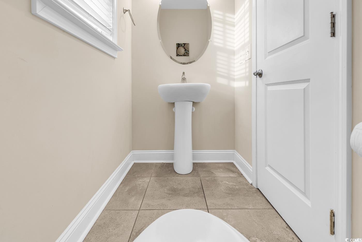 117 B 16th Avenue South Surfside Beach, SC 29575 - Photo 11 of 40 Bathroom with baseboards and light tile patterned floors