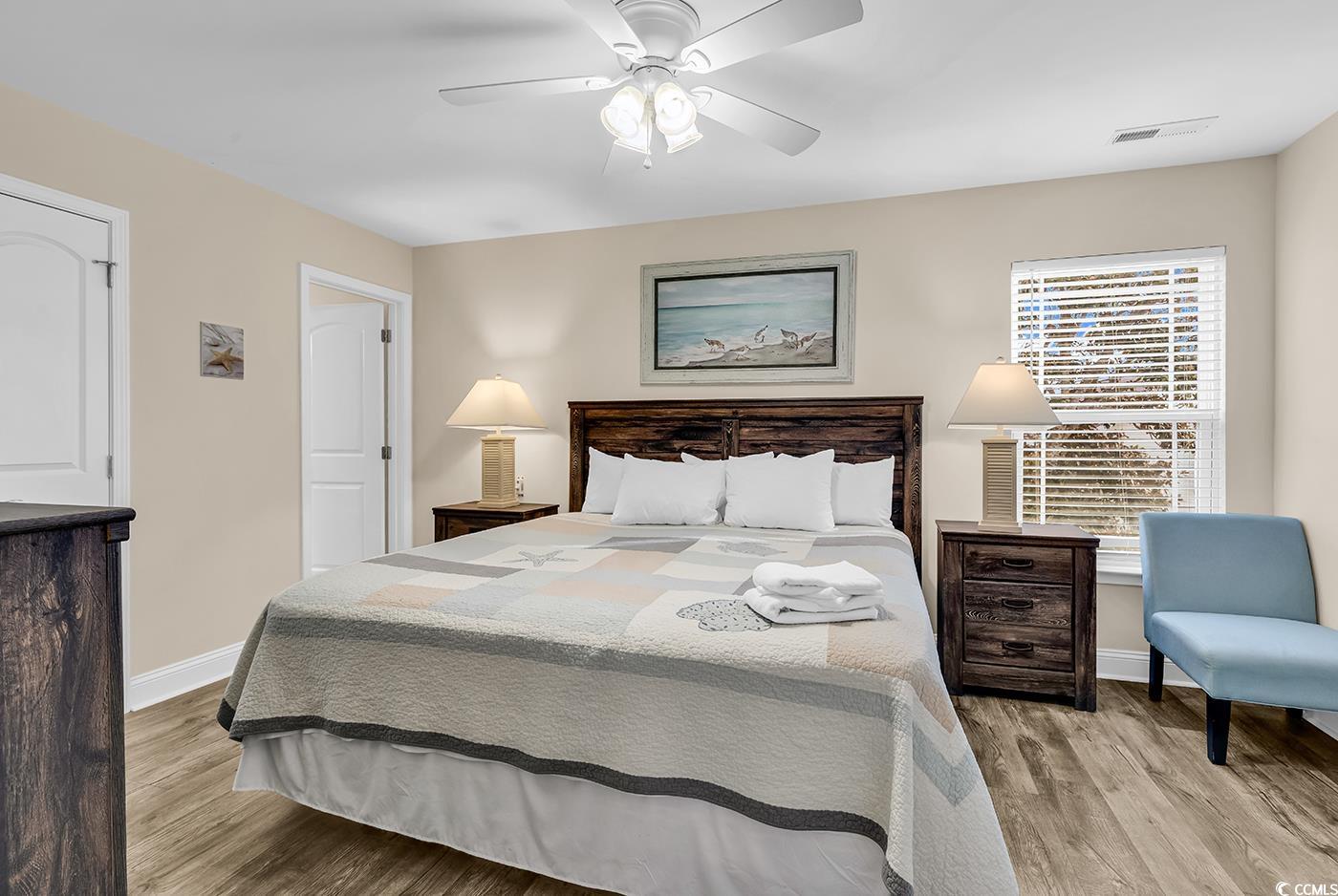 117 B 16th Avenue South Surfside Beach, SC 29575 - Photo 14 of 40 Bedroom with light wood-style floors and a ceiling fan