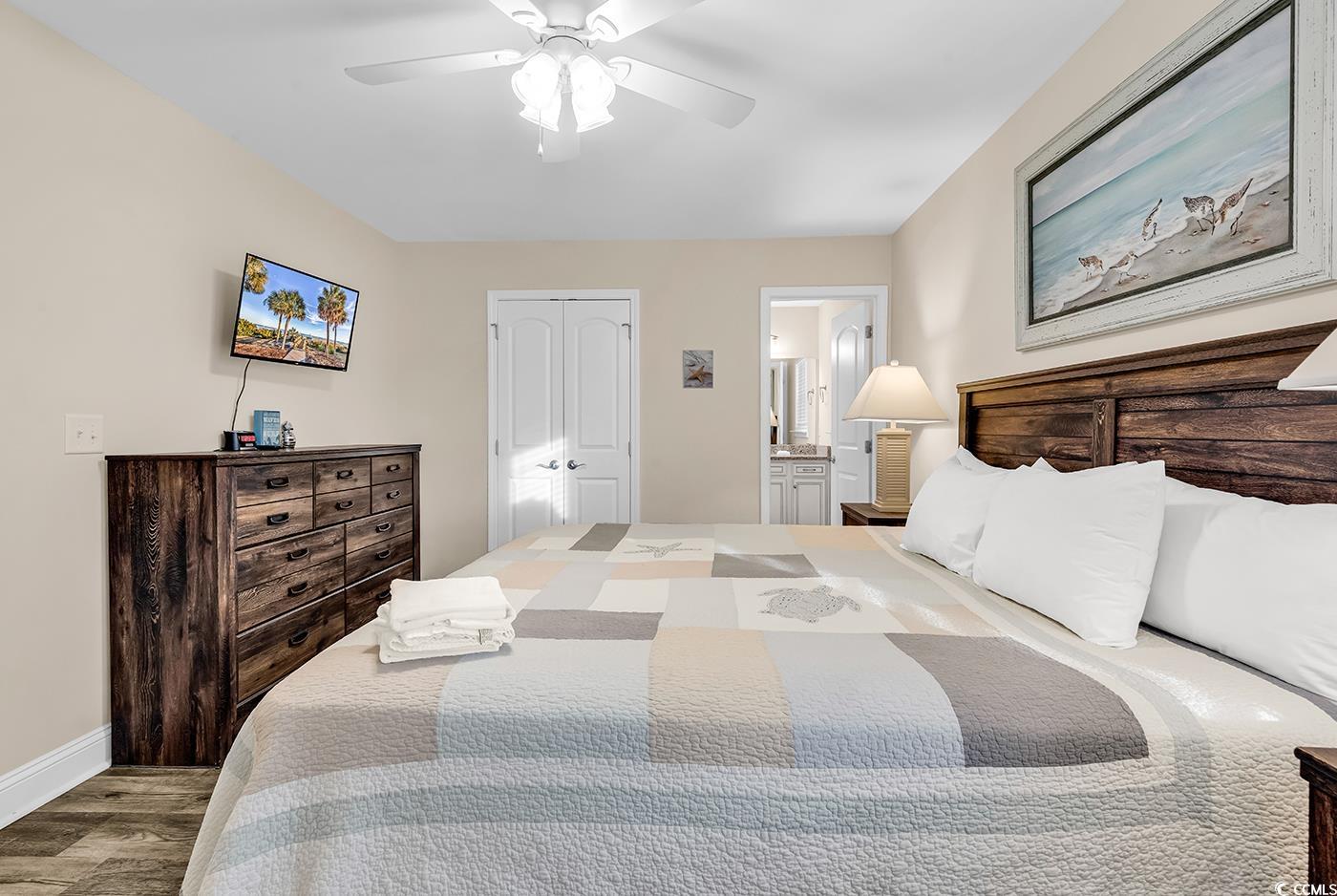 117 B 16th Avenue South Surfside Beach, SC 29575 - Photo 15 of 40 Bedroom with a closet, wood finished floors, ensuite bath, and a ceiling fan