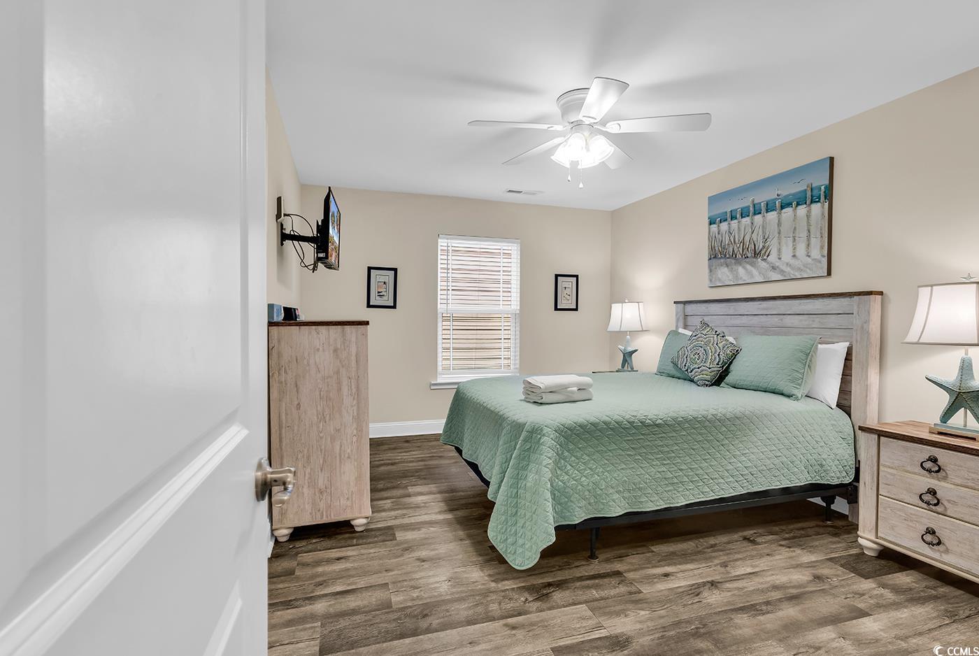 117 B 16th Avenue South Surfside Beach, SC 29575 - Photo 17 of 40 Bedroom with wood finished floors and ceiling fan