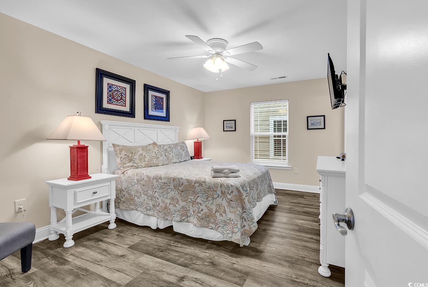 117 B 16th Avenue South Surfside Beach, SC 29575 - Photo 20 of 40 Bedroom featuring wood finished floors and a ceiling fan