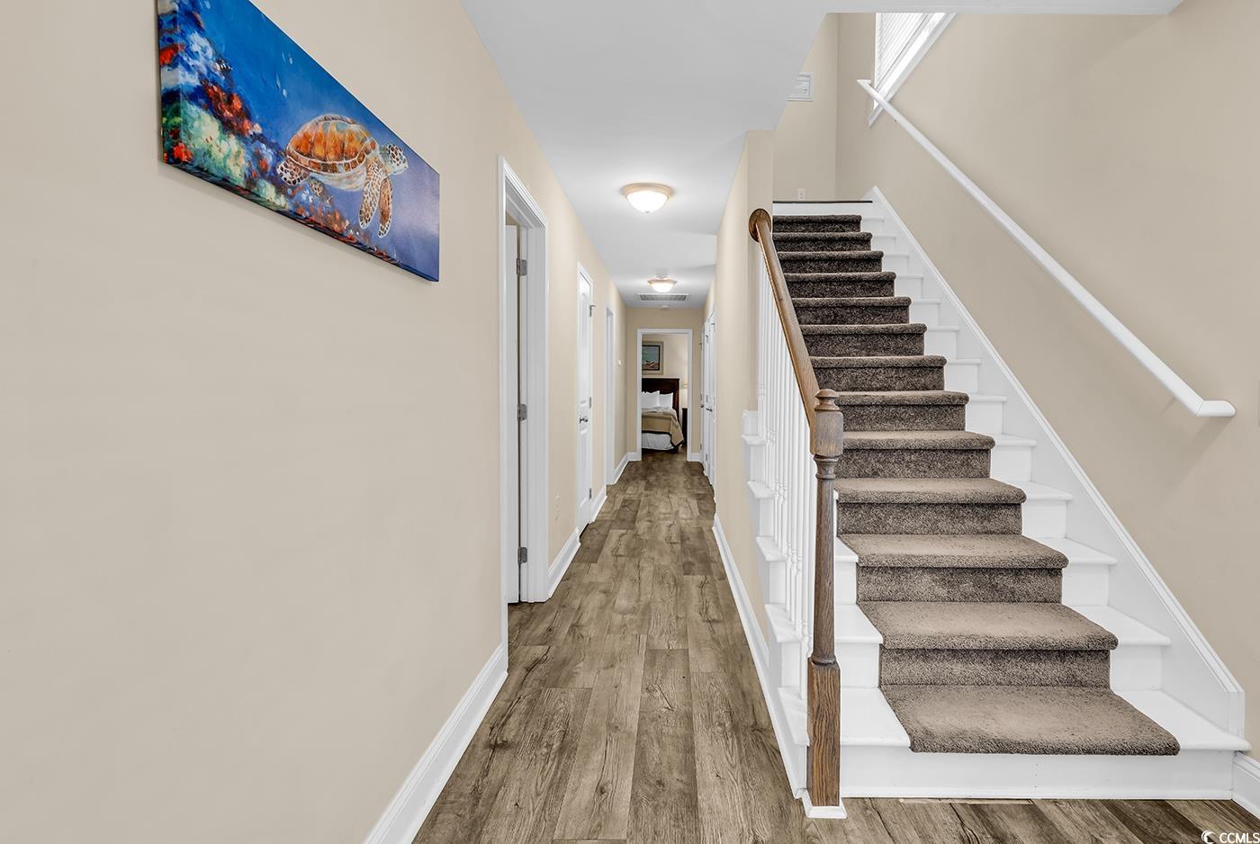 117 B 16th Avenue South Surfside Beach, SC 29575 - Photo 26 of 40 Corridor with light wood-style floors and stairway