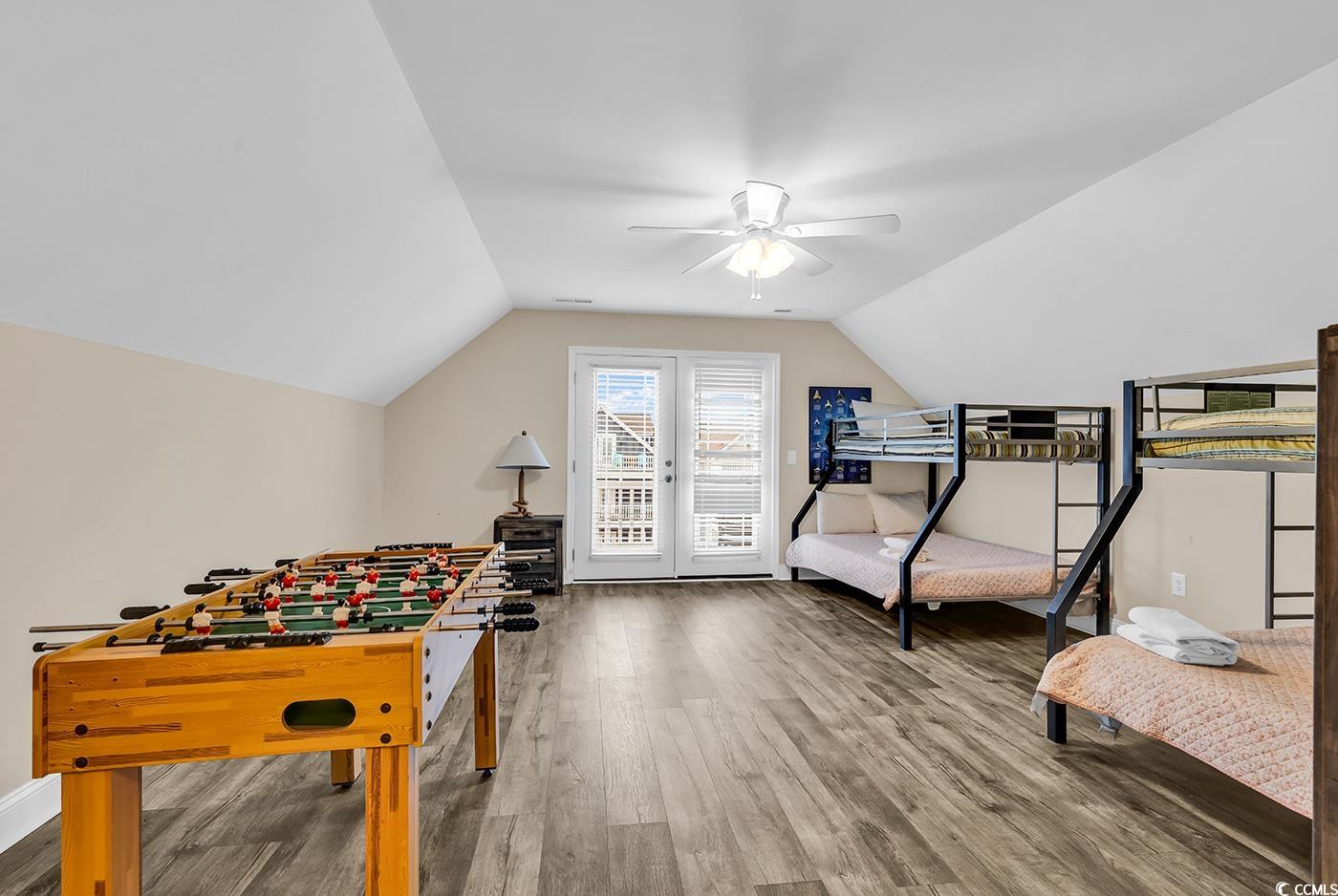 117 B 16th Avenue South Surfside Beach, SC 29575 - Photo 30 of 40 Recreation room with wood finished floors and vaulted ceiling