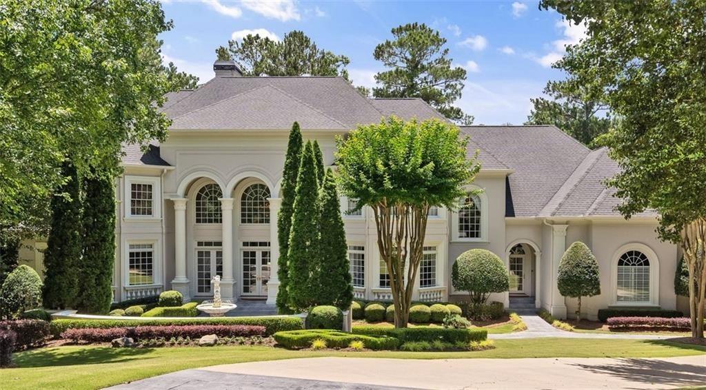 9330 Colonnade Trail Alpharetta, GA 30022 - Photo 1 of 1 a front view of a house with yard and green space
