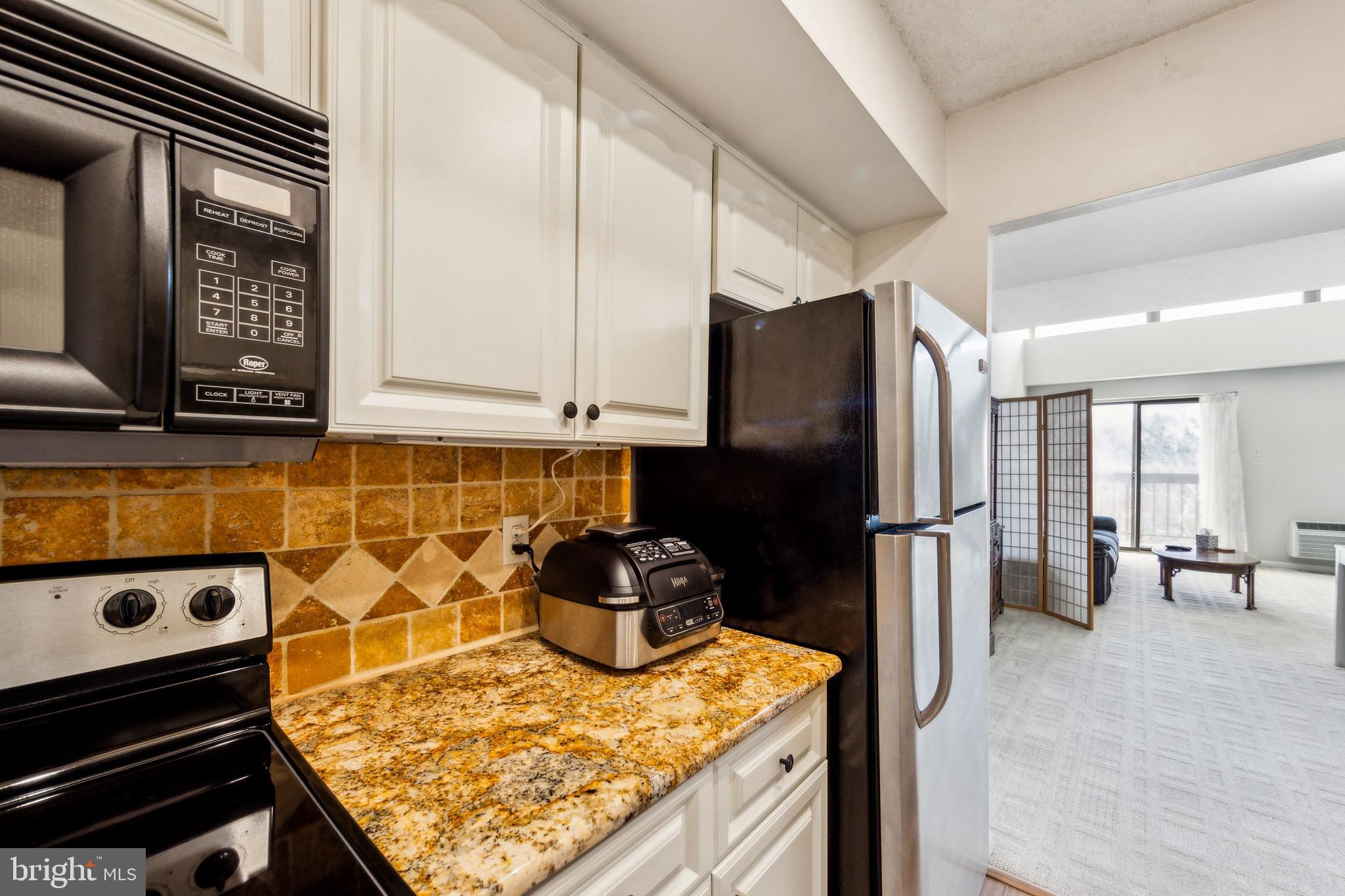 700 Avondale Road, Unit PH8 Wallingford, PA 19086 - Photo 12 of 24 Kitchen open to dining area