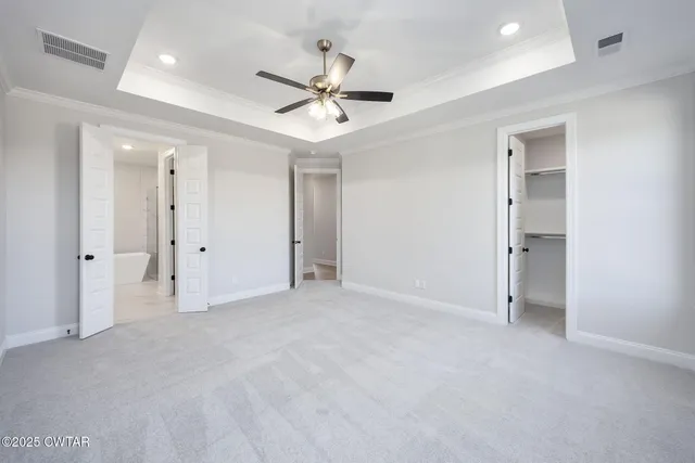 a view of room with a ceiling fan and a chandelier fan