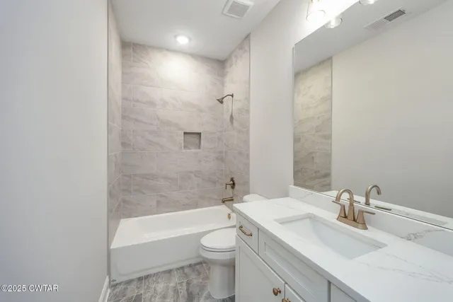 an aerial view of a house with a lake view