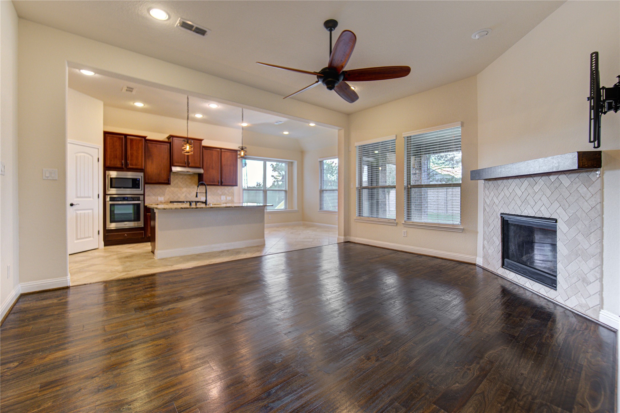 6622 Tiger Trail Katy, TX 77493 - Photo 12 of 49 a view of a living room a kitchen and a wooden floor
