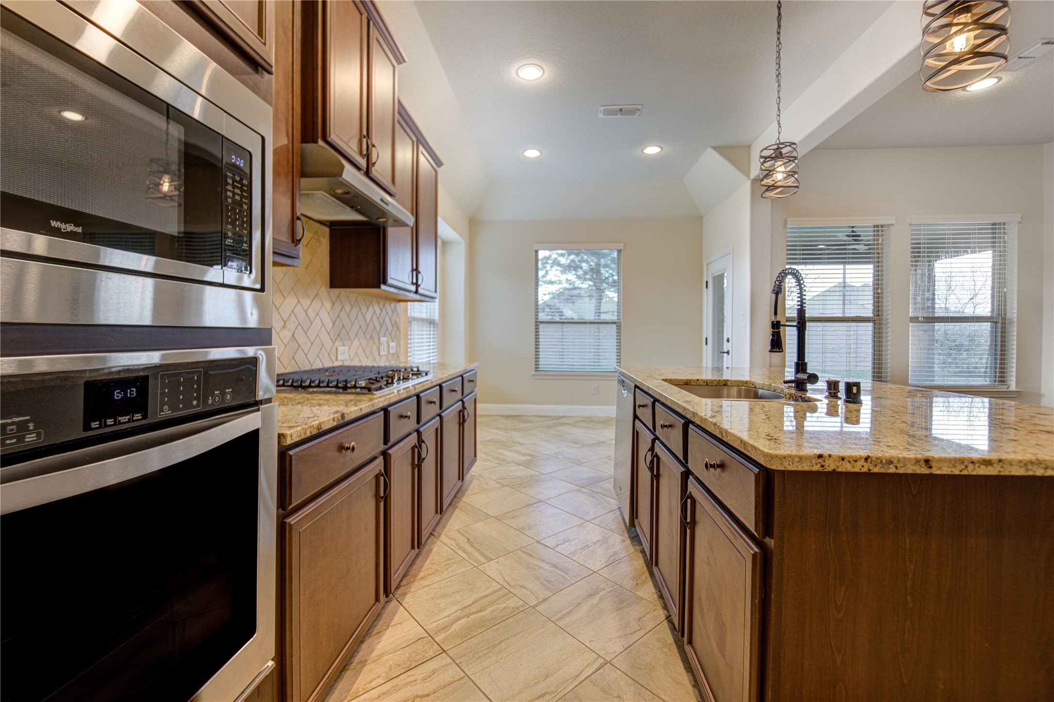 6622 Tiger Trail Katy, TX 77493 - Photo 19 of 49 a kitchen with stainless steel appliances granite countertop a sink and stove