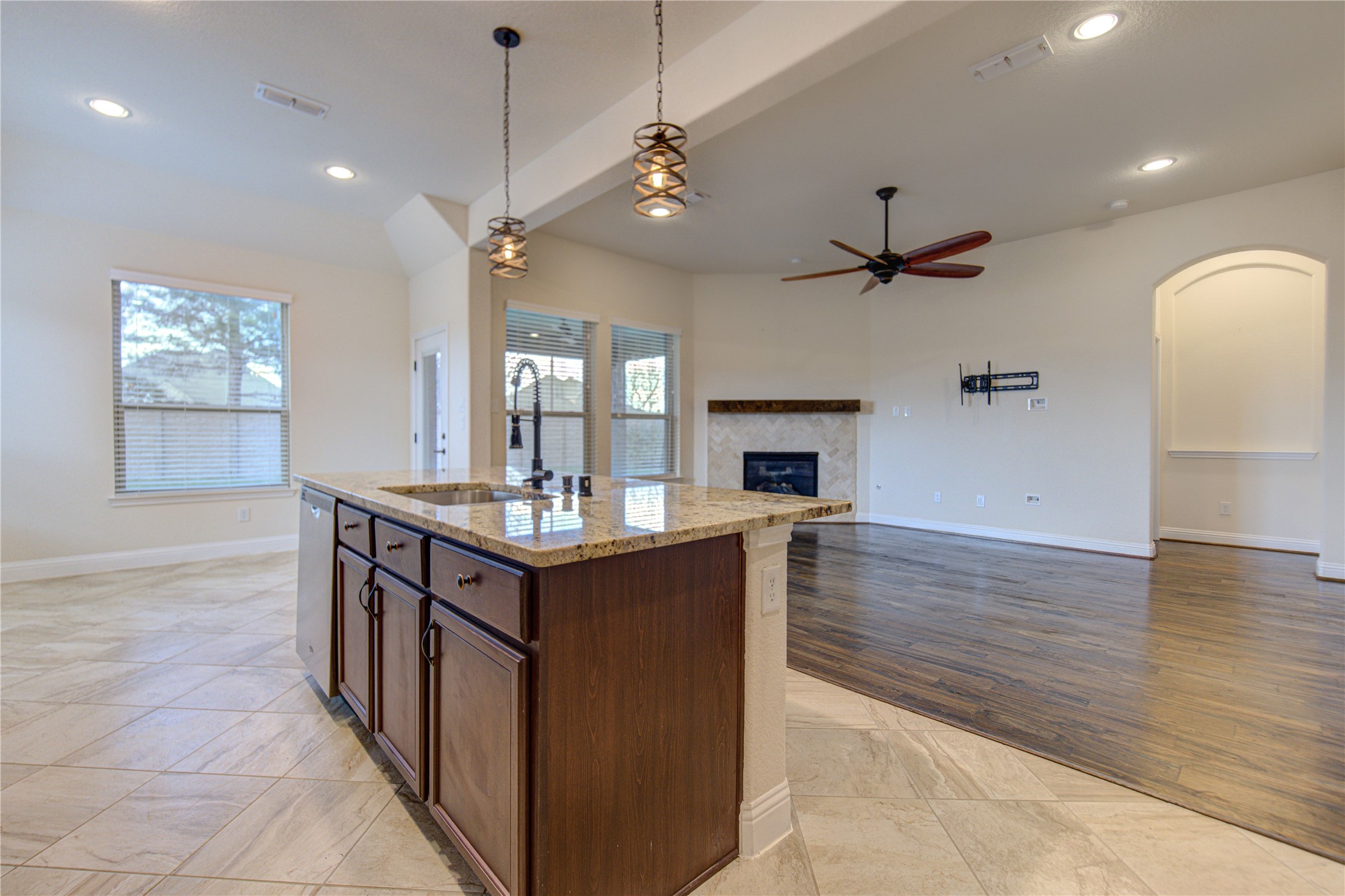 6622 Tiger Trail Katy, TX 77493 - Photo 21 of 49 a kitchen with stainless steel appliances granite countertop a sink a oven and a fireplace