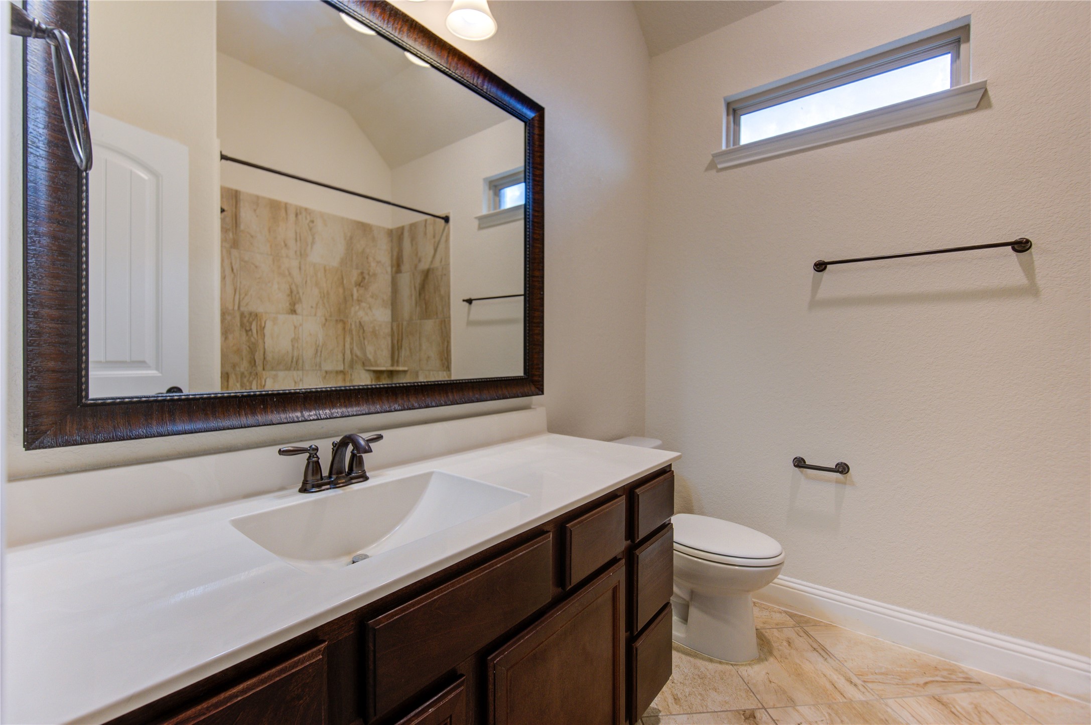 6622 Tiger Trail Katy, TX 77493 - Photo 35 of 49 a bathroom with a sink toilet a mirror and vanity