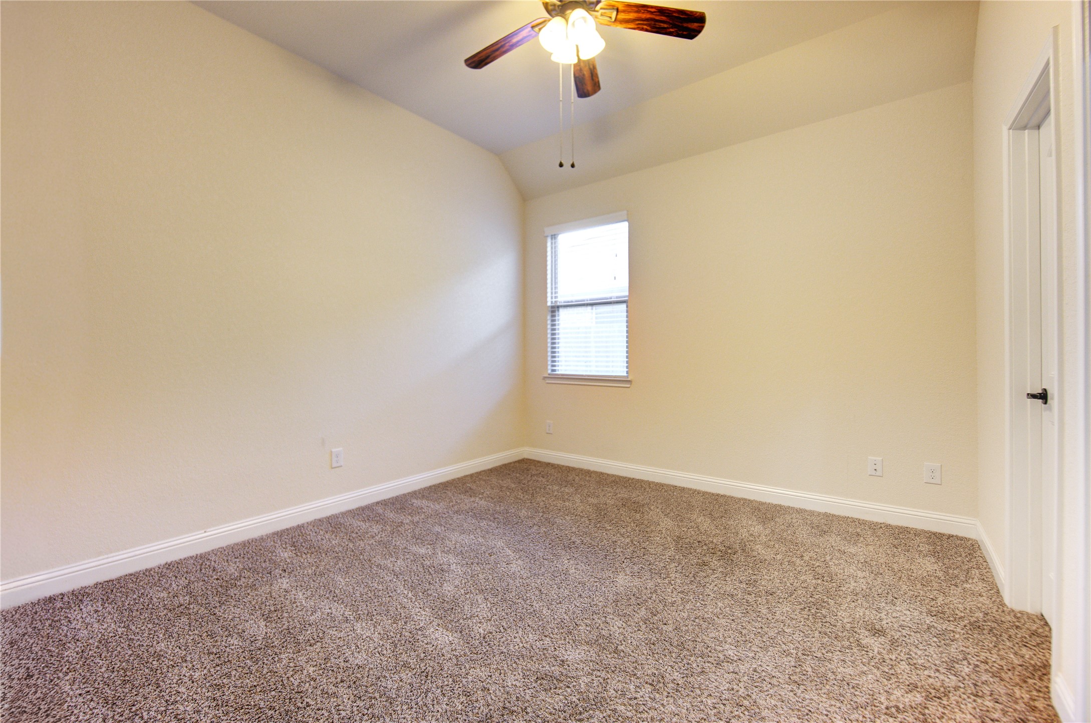 6622 Tiger Trail Katy, TX 77493 - Photo 37 of 49 an empty room with a chandelier fan and windows