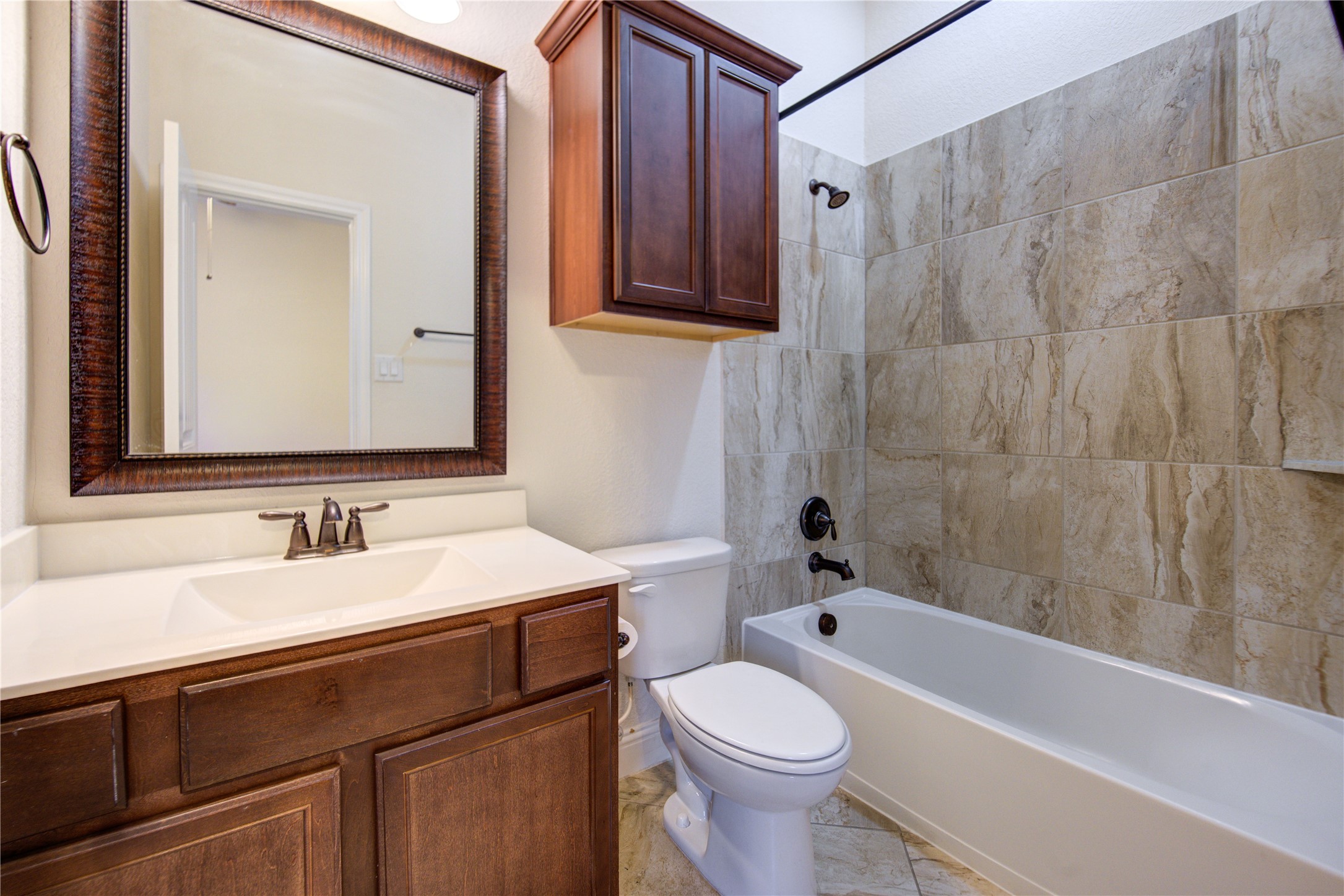 6622 Tiger Trail Katy, TX 77493 - Photo 39 of 49 a bathroom with a sink a toilet and a bathtub
