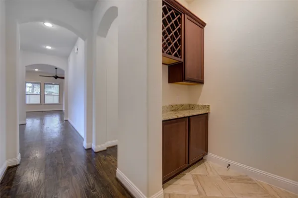 a view of an entryway and wooden floor