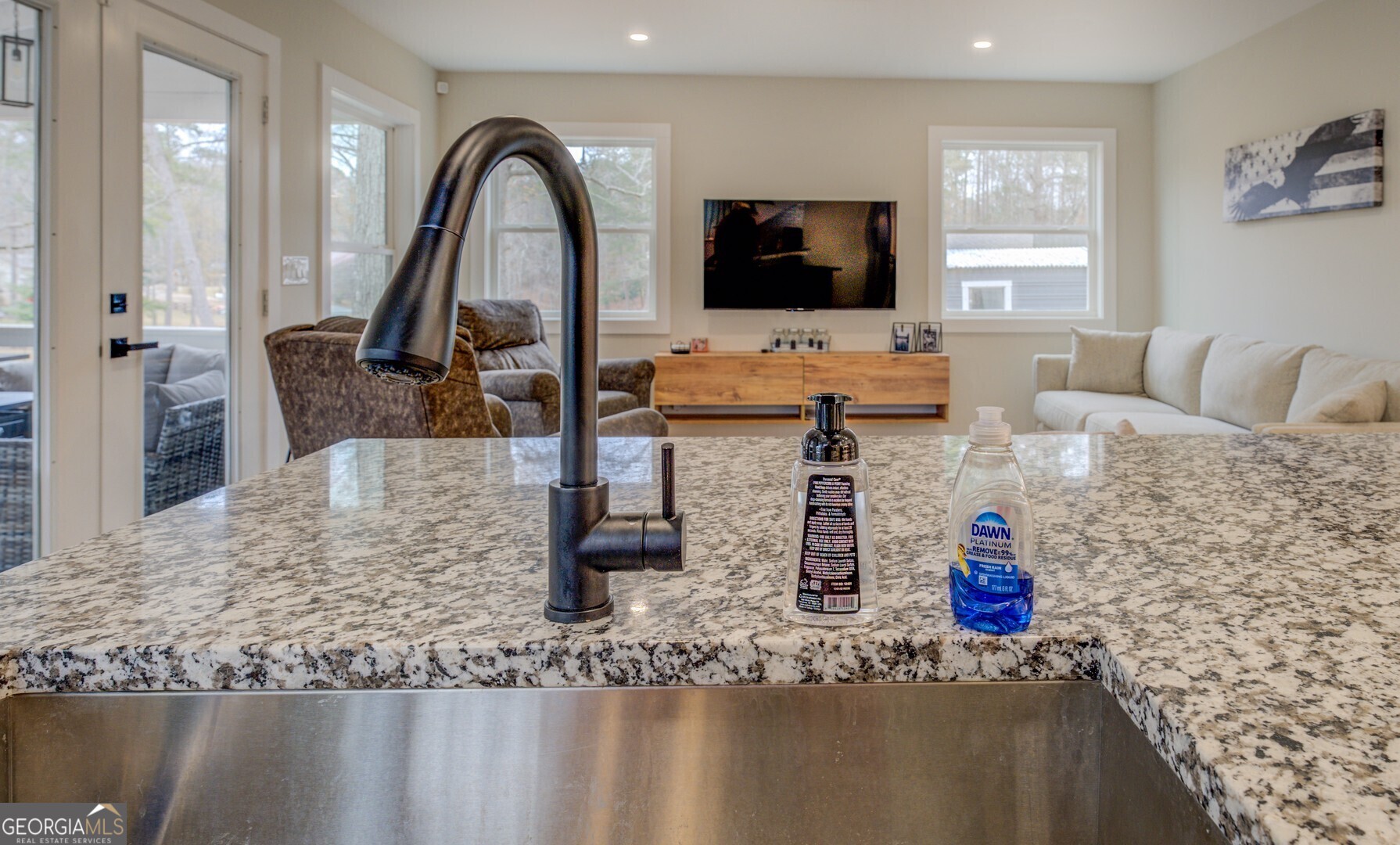 480 Mitchell Road Covington, GA 30014 - Photo 17 of 56 a kitchen with stainless steel appliances granite countertop a sink and a wooden floor