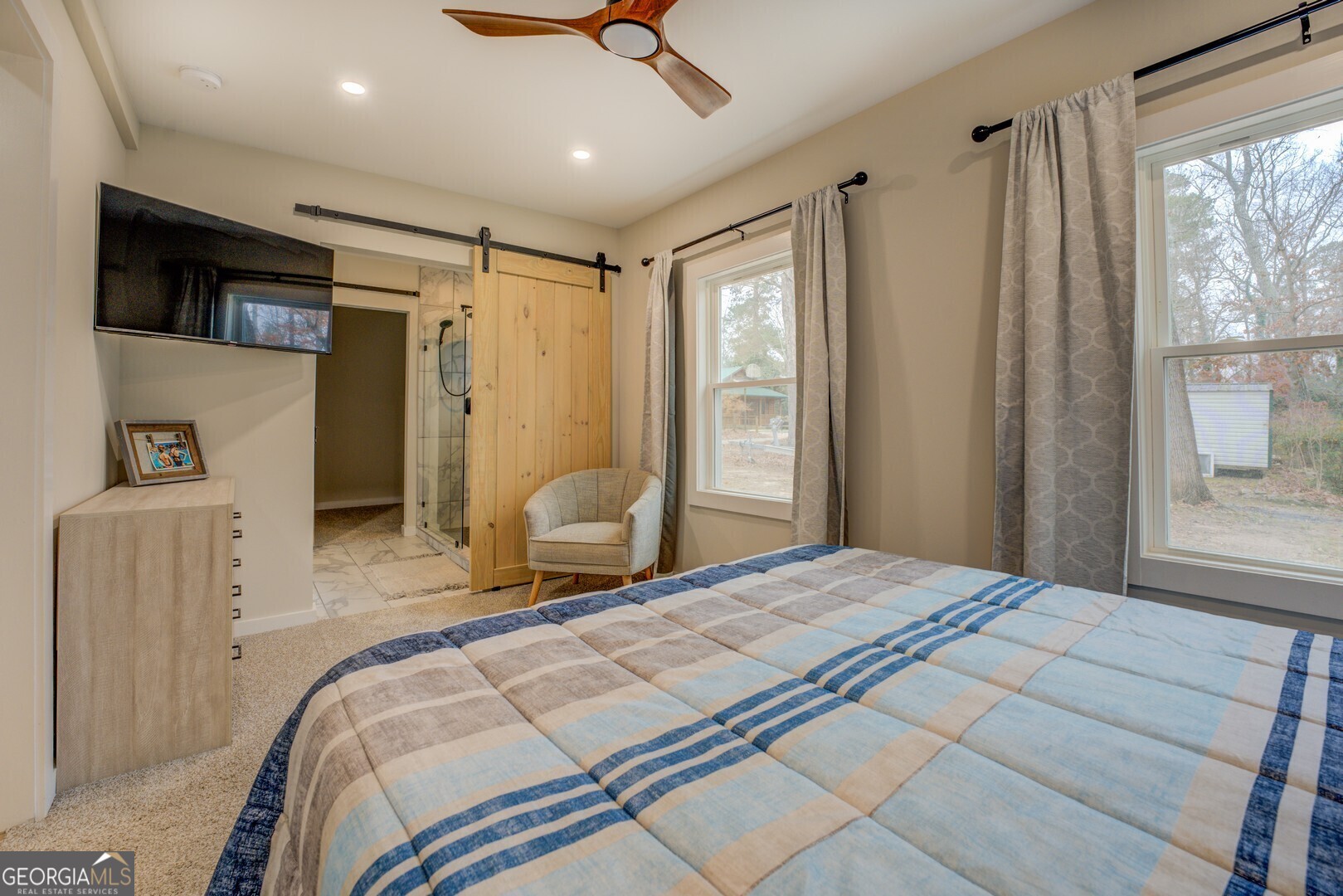 480 Mitchell Road Covington, GA 30014 - Photo 20 of 56 a bedroom with a bed and a large window