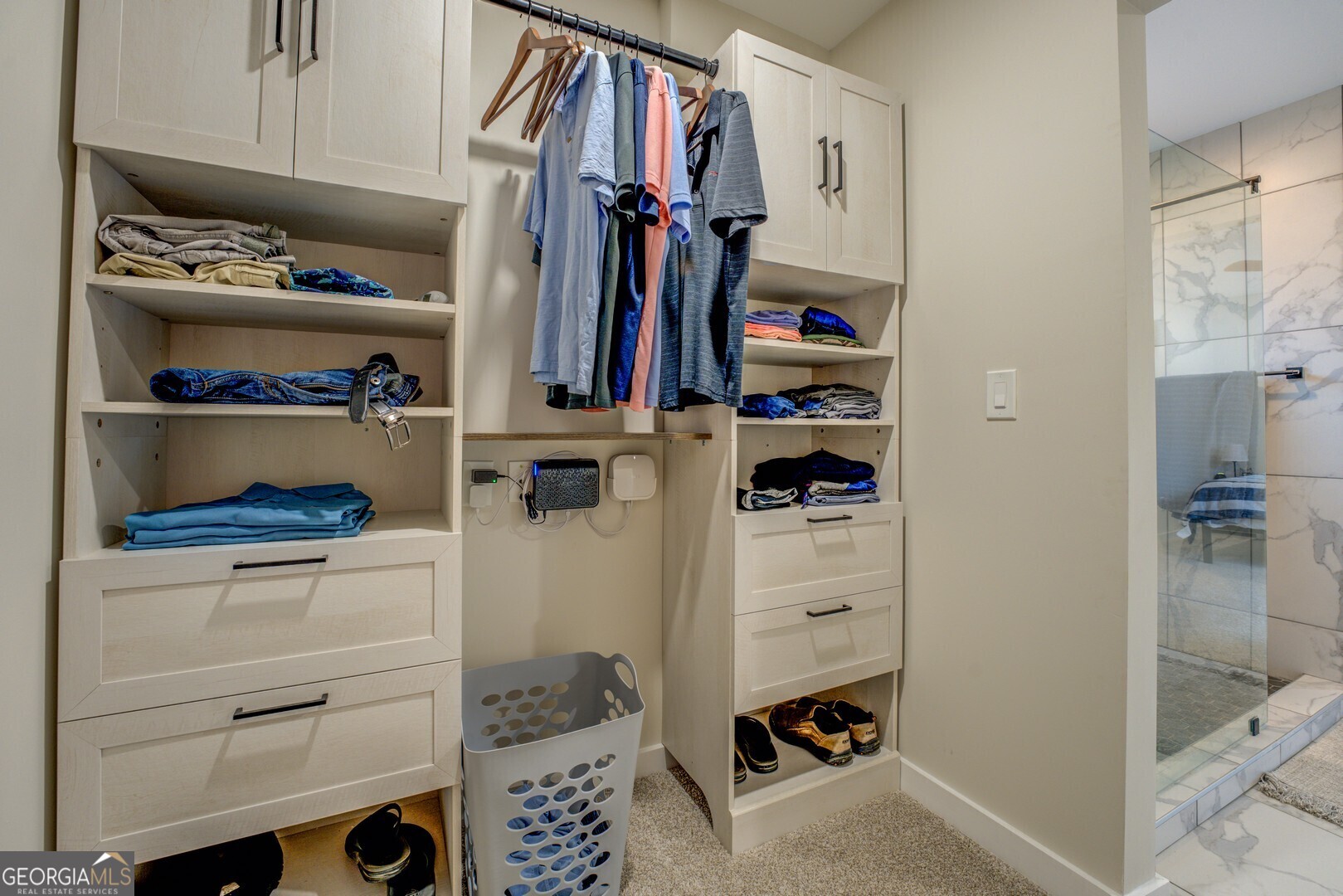 480 Mitchell Road Covington, GA 30014 - Photo 24 of 56 a view of walk in closet with clothes and shoes