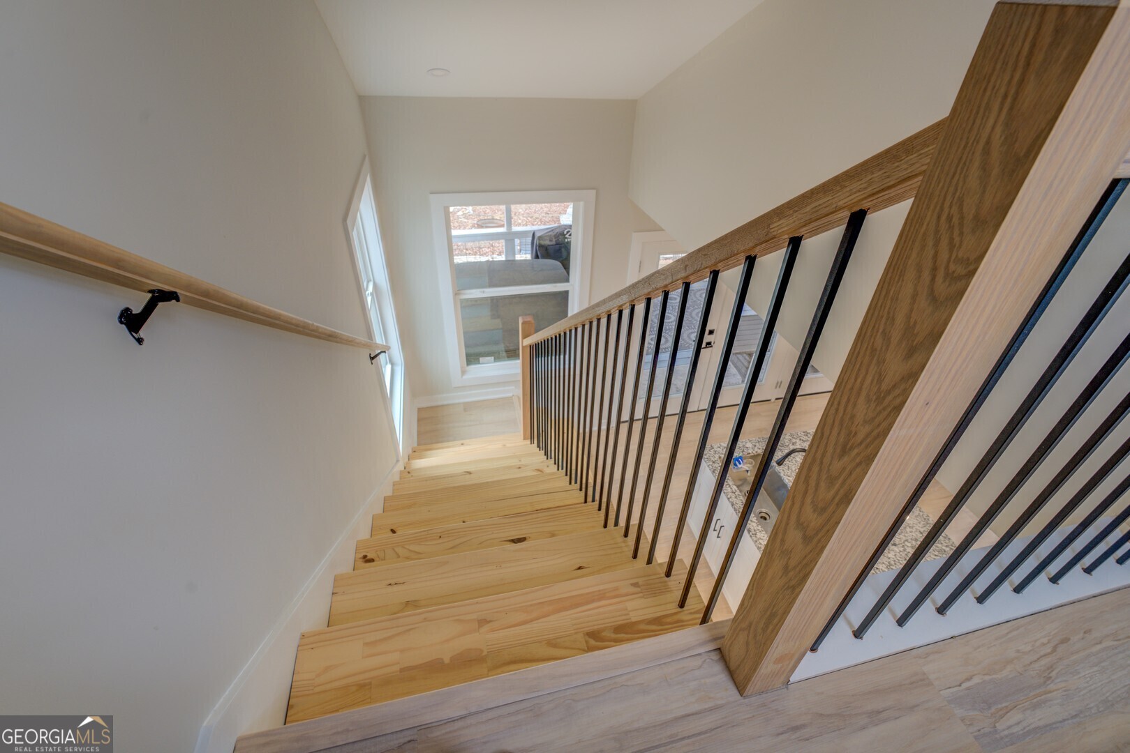 480 Mitchell Road Covington, GA 30014 - Photo 29 of 56 a view of a hallway with wooden floor and stairs