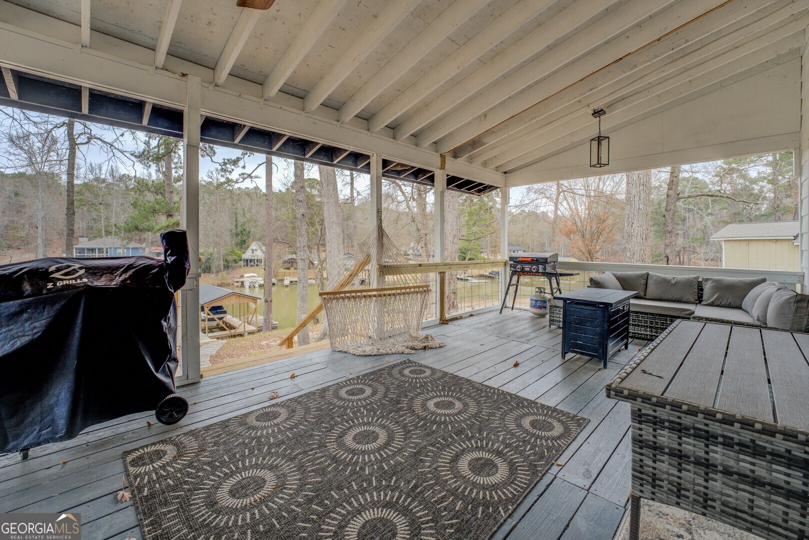 480 Mitchell Road Covington, GA 30014 - Photo 34 of 56 a living room with furniture and a floor to ceiling window