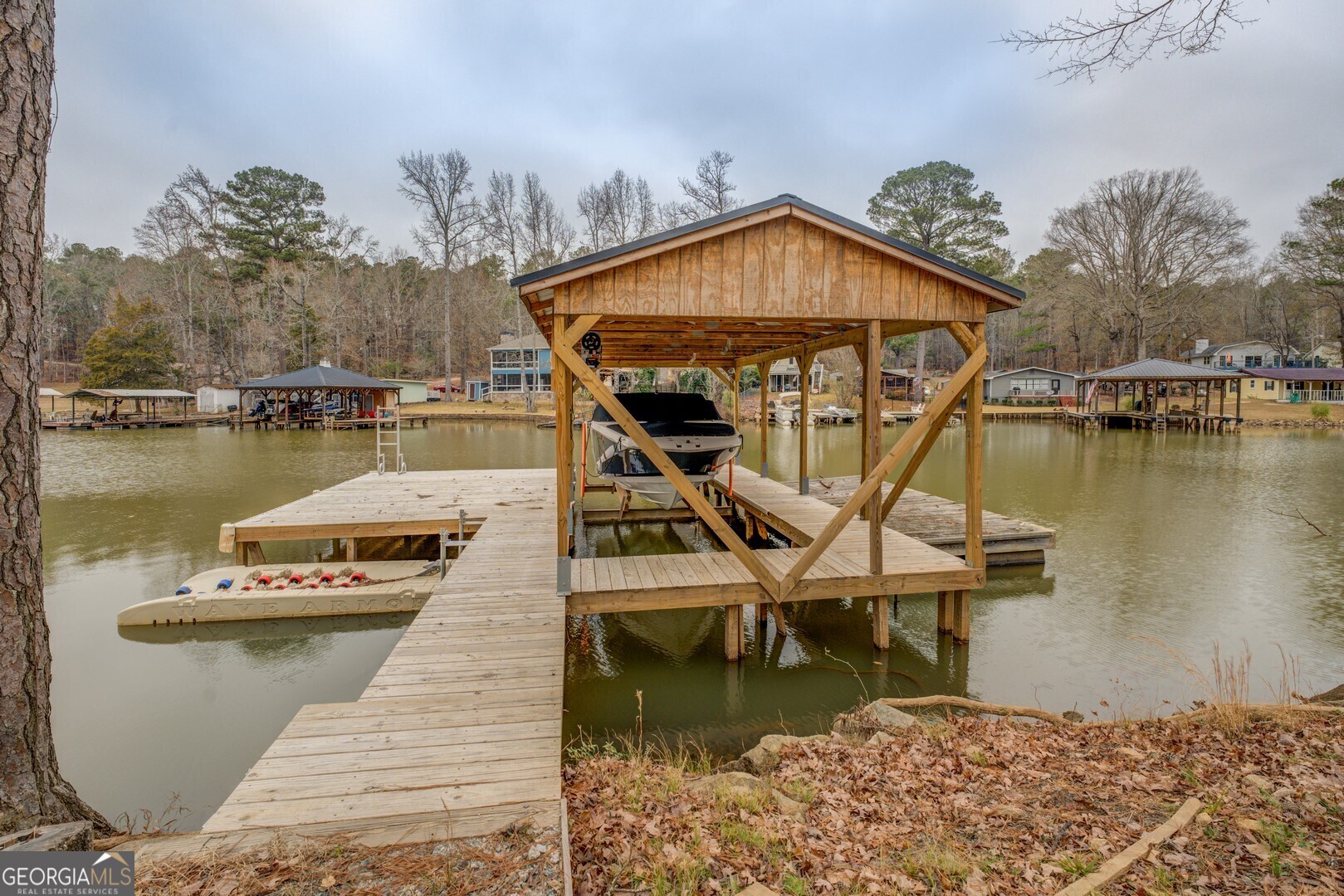 480 Mitchell Road Covington, GA 30014 - Photo 44 of 56 a view of a house with pool and lake view