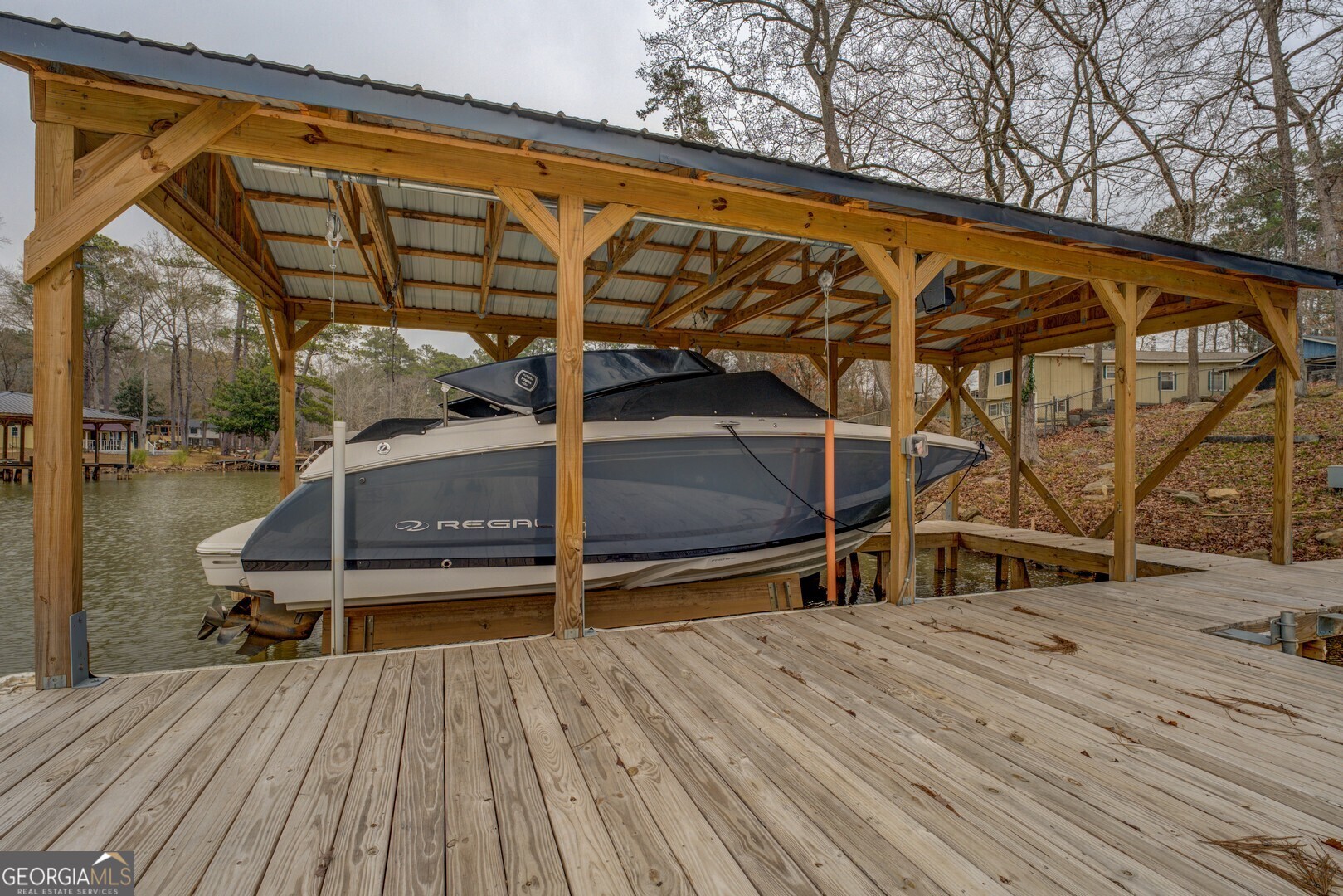 480 Mitchell Road Covington, GA 30014 - Photo 46 of 56 a view of a balcony with chairs and wooden floor