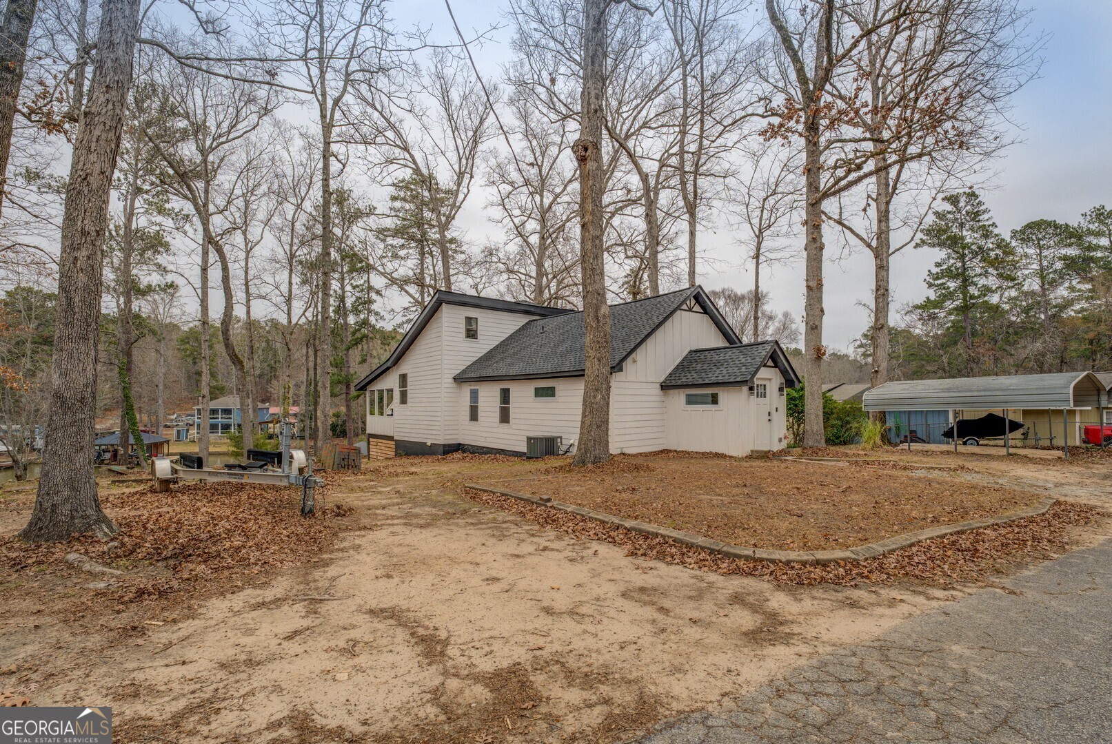 480 Mitchell Road Covington, GA 30014 - Photo 53 of 56 a view of house with a yard and large trees