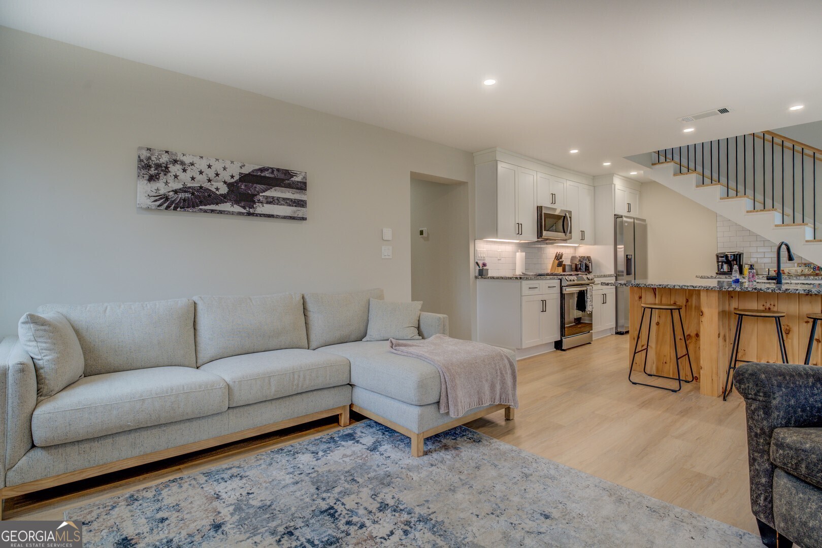 480 Mitchell Road Covington, GA 30014 - Photo 6 of 56 a living room with furniture and kitchen view