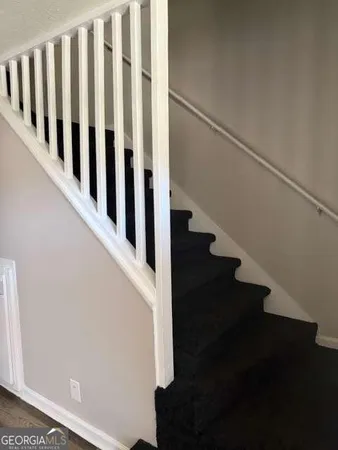a view of entryway with wooden floor