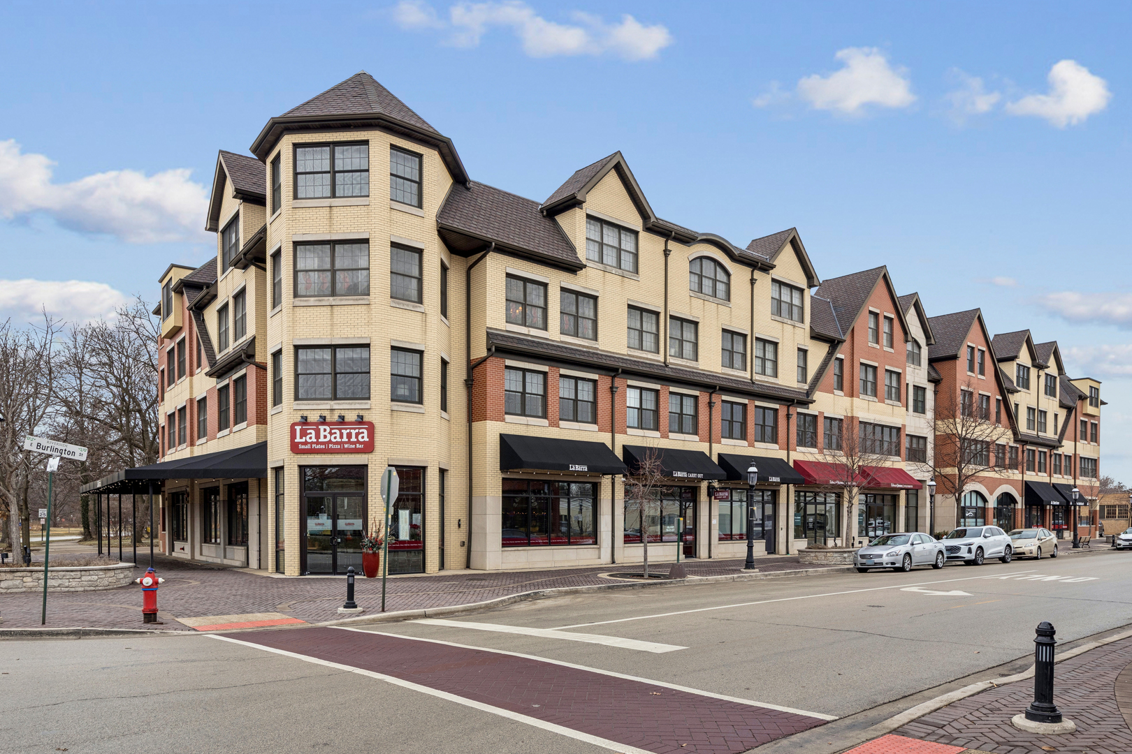 a front view of a building with street view and building