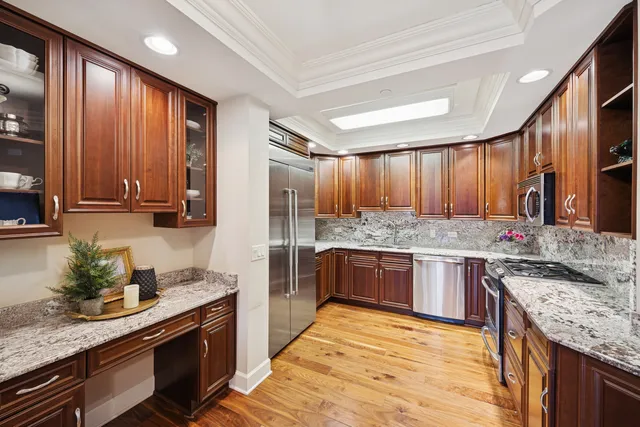 a kitchen with stainless steel appliances granite countertop counter space a sink and cabinets