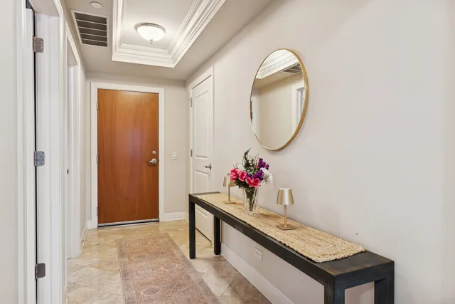 a view of an entryway with wooden floor