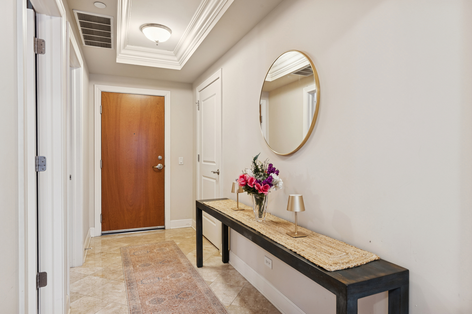10 East Burlington Street, Unit 2B Riverside, IL 60546 - Photo 6 of 38 a view of an entryway with wooden floor