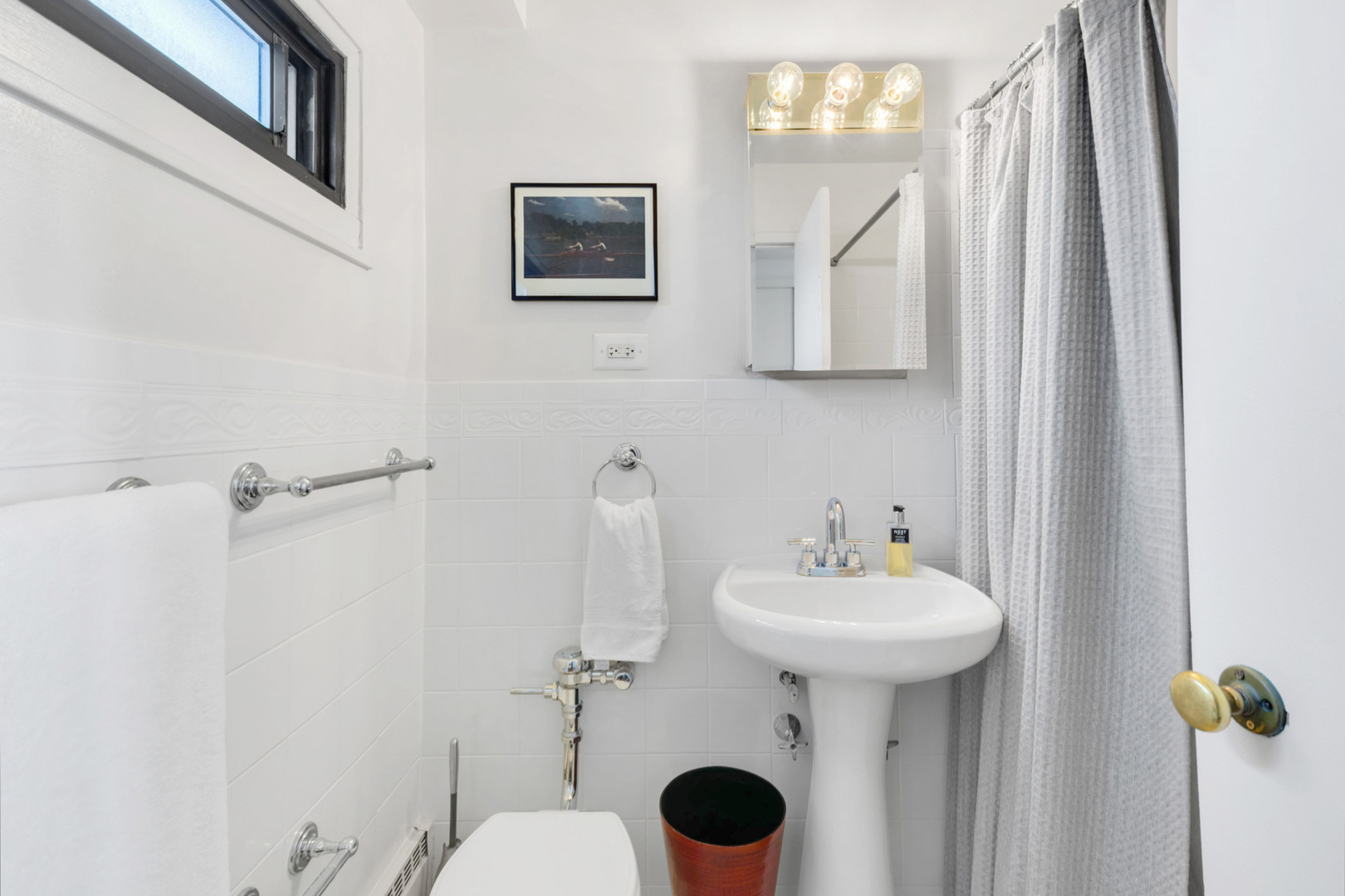 6030 North Sheridan Road, Unit 901 Chicago, IL 60660 - Photo 12 of 17 a bathroom with a sink a mirror and a toilet