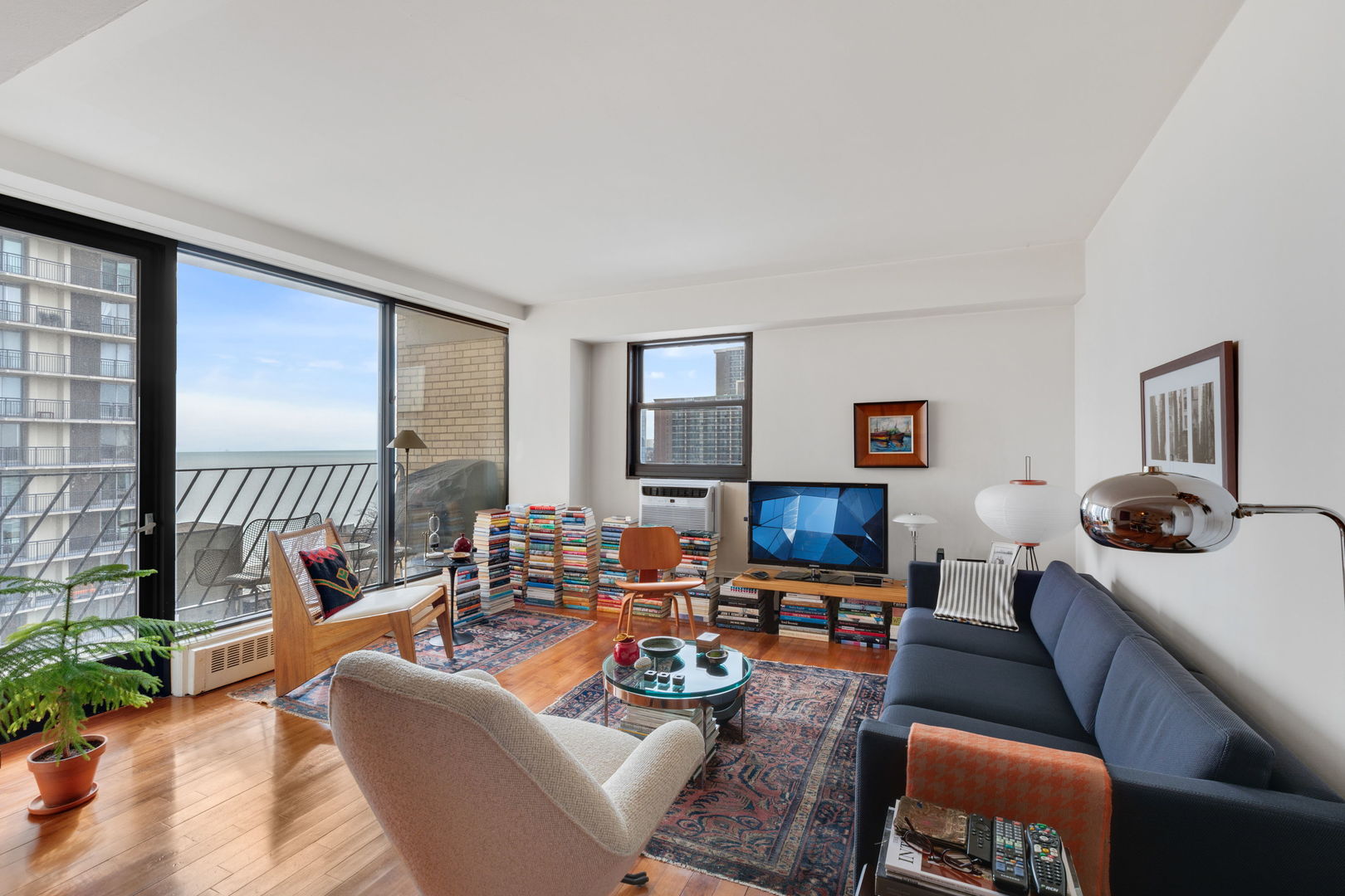 6030 North Sheridan Road, Unit 901 Chicago, IL 60660 - Photo 2 of 17 a living room with furniture and a large window