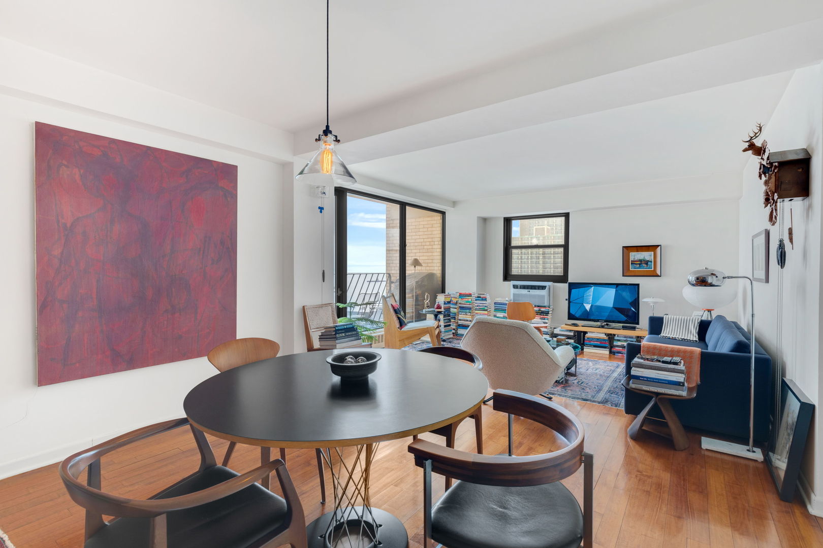 6030 North Sheridan Road, Unit 901 Chicago, IL 60660 - Photo 6 of 17 a dining room with furniture a rug and a chandelier