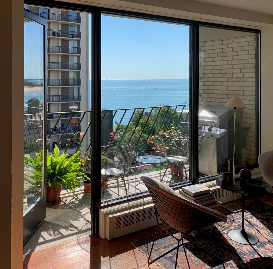 6030 North Sheridan Road, Unit 901 Chicago, IL 60660 - Photo 7 of 17 a view of a balcony with chairs and a potted plant