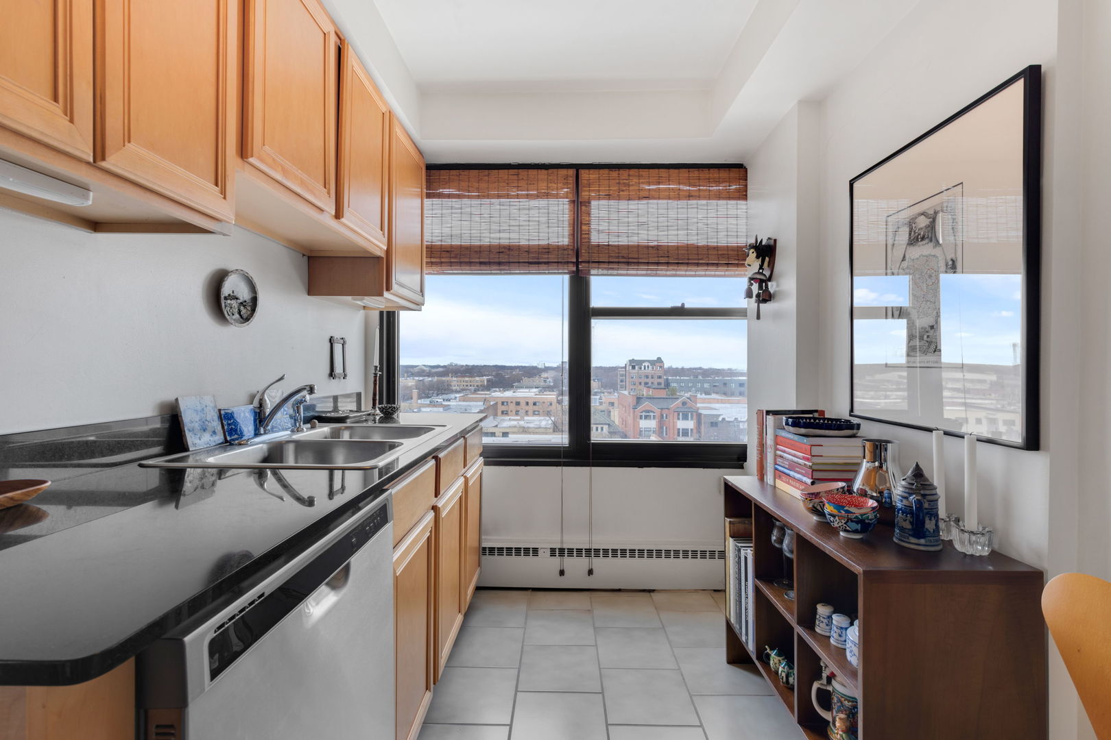 6030 North Sheridan Road, Unit 901 Chicago, IL 60660 - Photo 9 of 17 a kitchen with a sink stove and cabinets