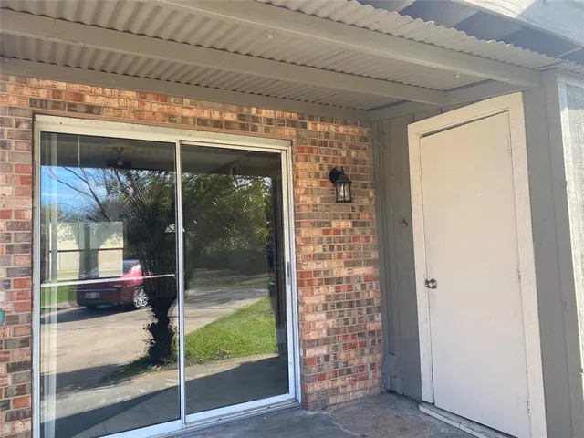 a view of a glass door and the porch