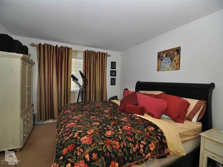 2547 Canterbury Lane Simi Valley, CA 93063 - Photo 11 of 12 a bed sitting in a bedroom next to a window