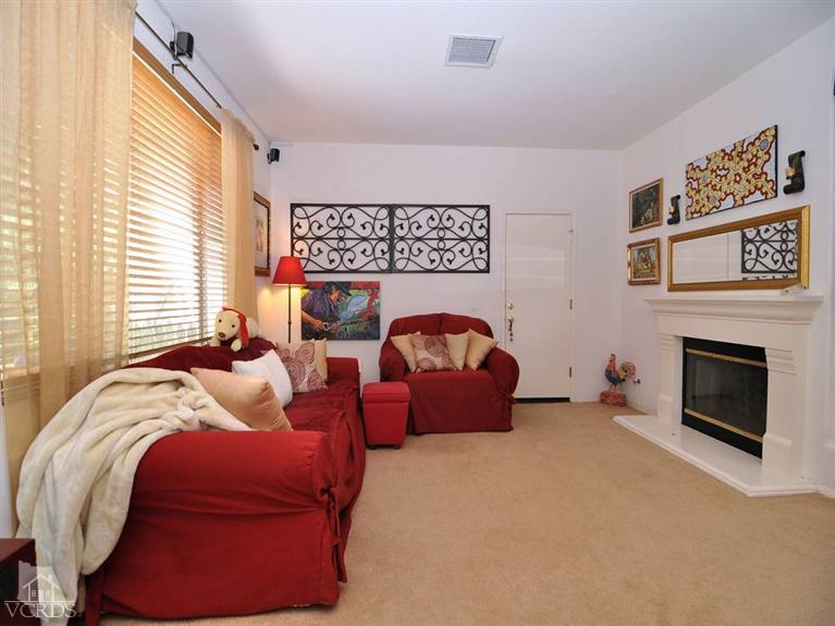 2547 Canterbury Lane Simi Valley, CA 93063 - Photo 5 of 12 a bed room with a bed and a fireplace
