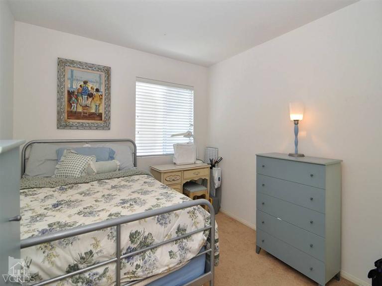 2547 Canterbury Lane Simi Valley, CA 93063 - Photo 9 of 12 a bedroom with a bed and a window