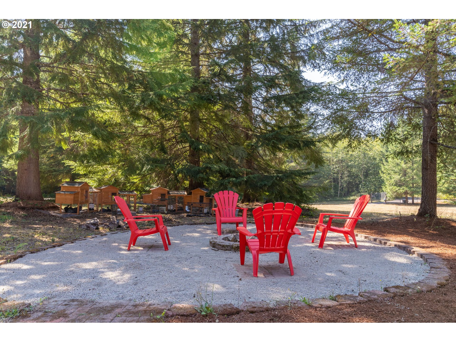 28075 South Kinzy Road Estacada, OR 97023 - Photo 29 of 32 a backyard of a house with outdoor seating