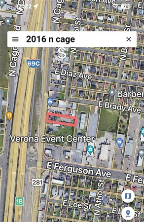 a view of yard with swimming pool and trees in the background