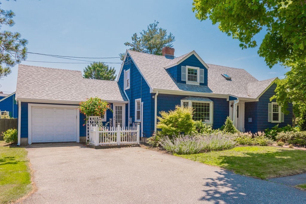 2 Princeton Avenue Beverly, MA 01915 - Photo 20 of 27 a front view of house with yard and trees in the background