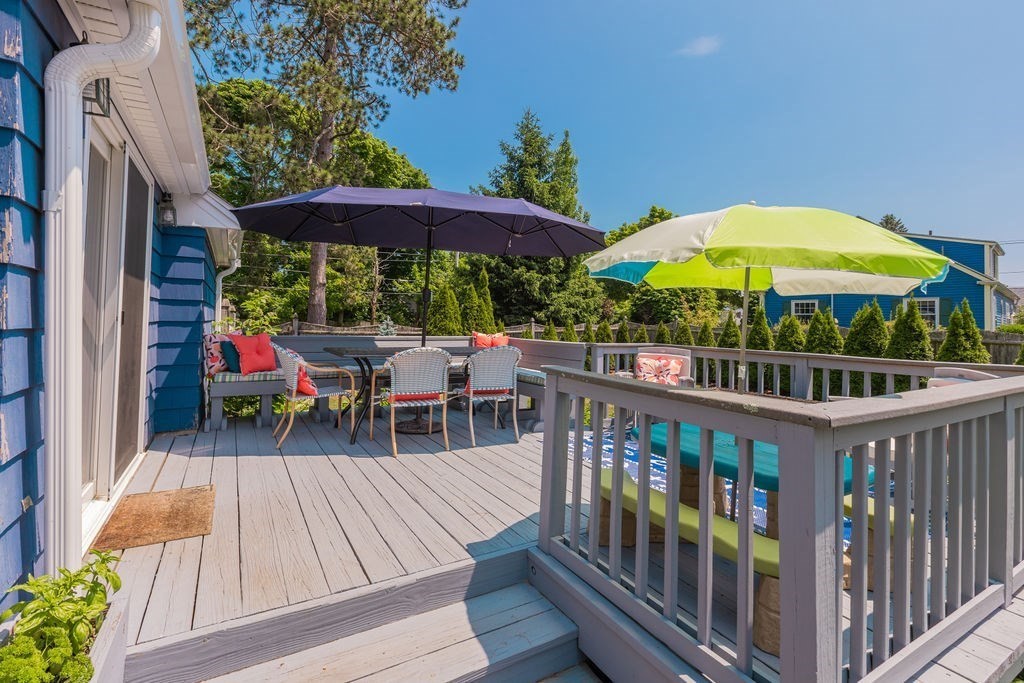 2 Princeton Avenue Beverly, MA 01915 - Photo 27 of 27 a view of a deck with furniture and umbrella